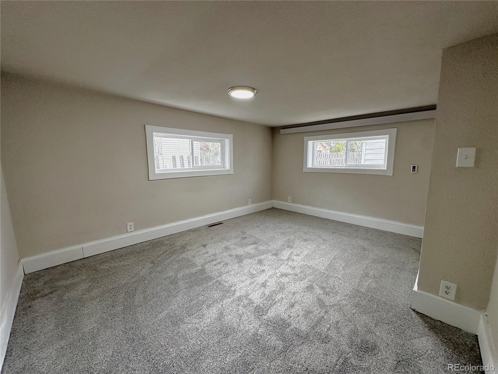 672 4th Street Limon, CO 80828 - Photo 16 of 28 an empty room with windows