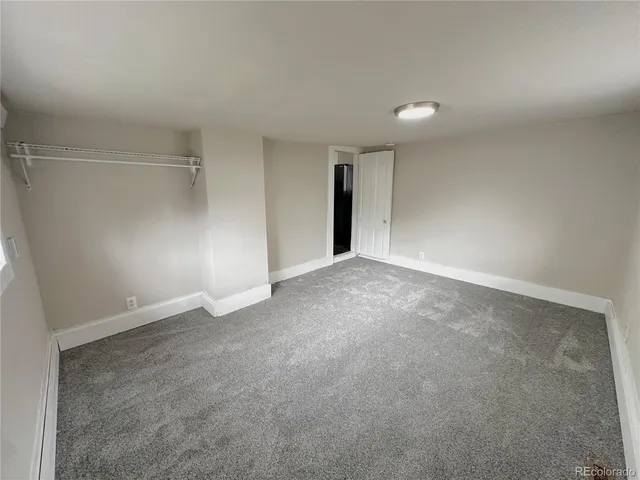 a kitchen with granite countertop white cabinets and sink