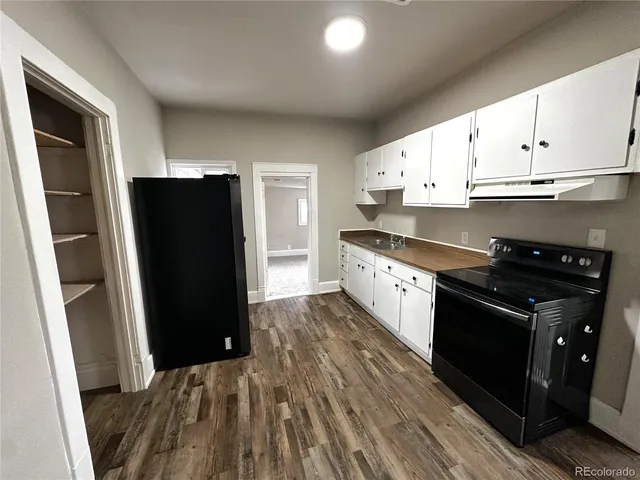 a view of a room with window and cabinet