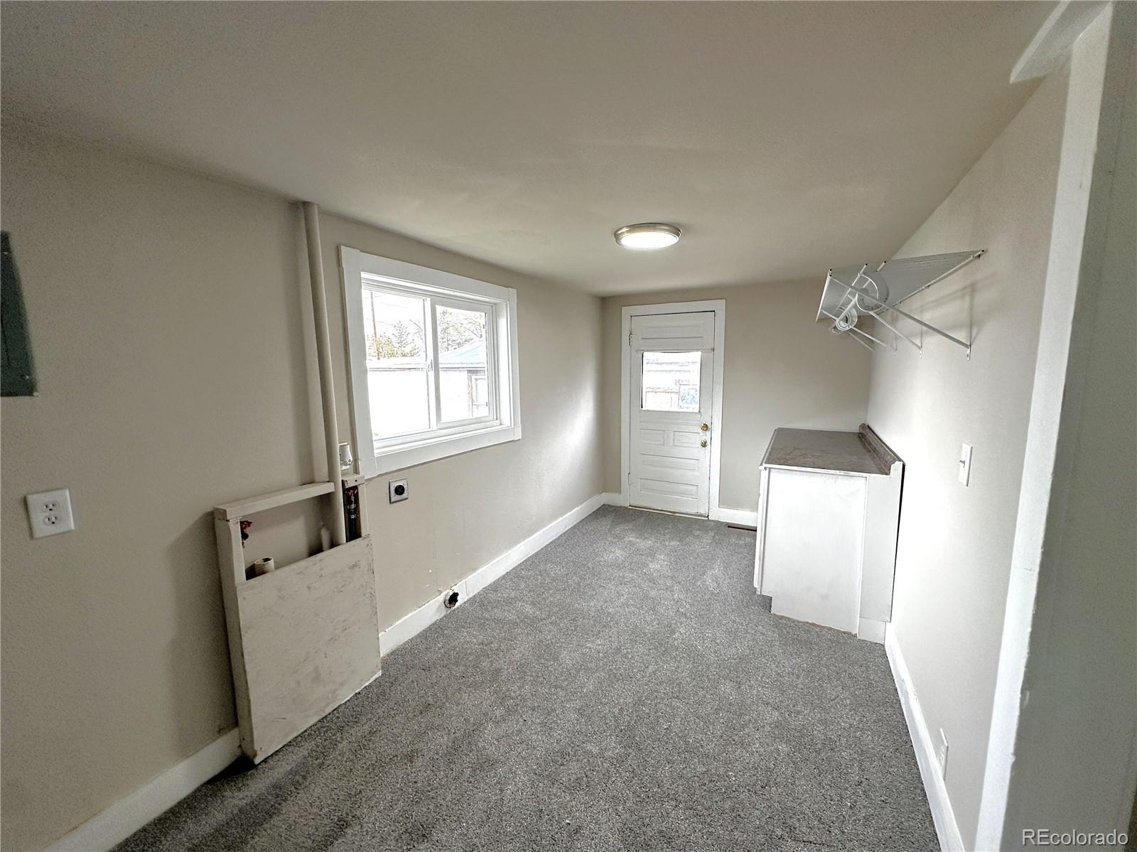 672 4th Street Limon, CO 80828 - Photo 22 of 28 a view of a room with window and cabinet