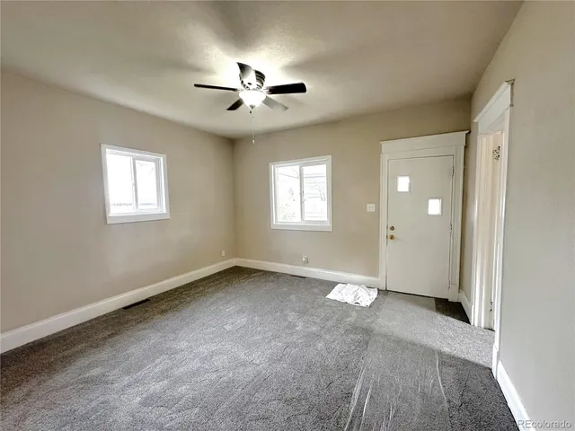 a view of an empty room with a window