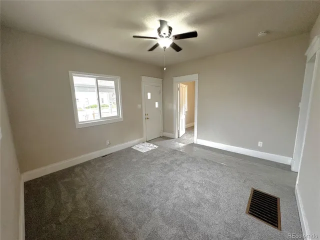 an empty room with a mirror