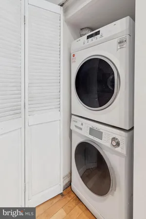 a view of a hallway with washer and dryer