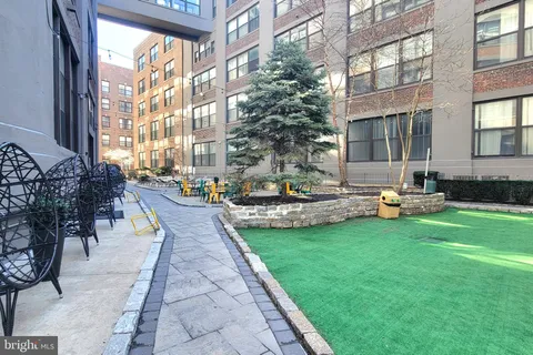 a swimming pool with outdoor seating and yard