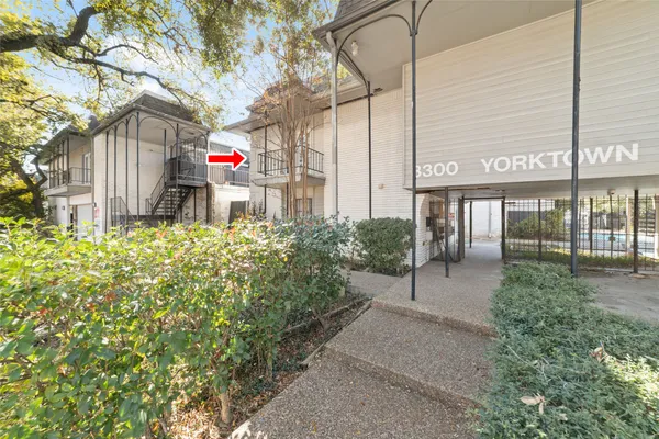 a backyard of a building with trees