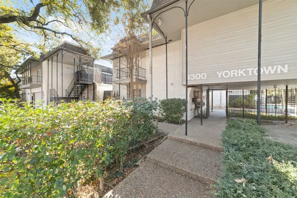 a view of a building with a yard