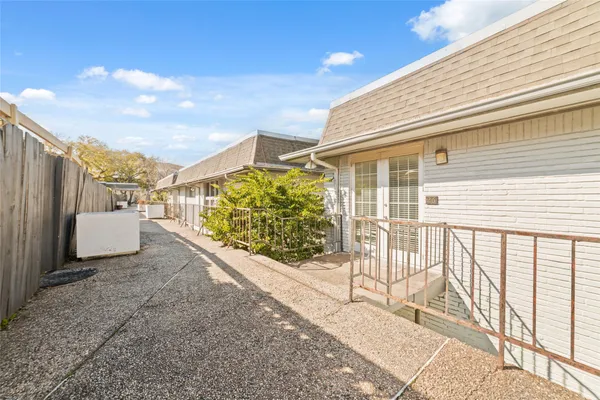 a view of a terrace with wooden fence
