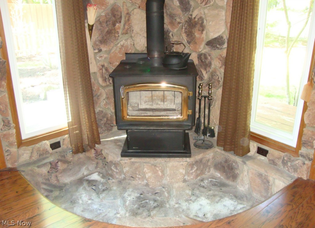 5698 Rock Point Circle North Ridgeville, OH 44039 - Photo 10 of 25 Woodburner adds to the coziness of the sunroom in the winter months!