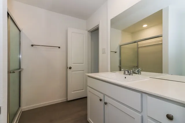 a bathroom with a sink and a mirror
