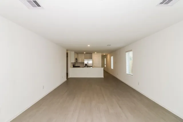 a view of a livingroom and a kitchen