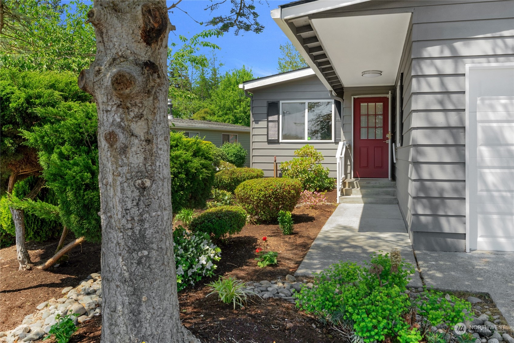 23714 Vista View Avenue Bothell, WA 98021 - Photo 3 of 6 a front view of a house with a yard