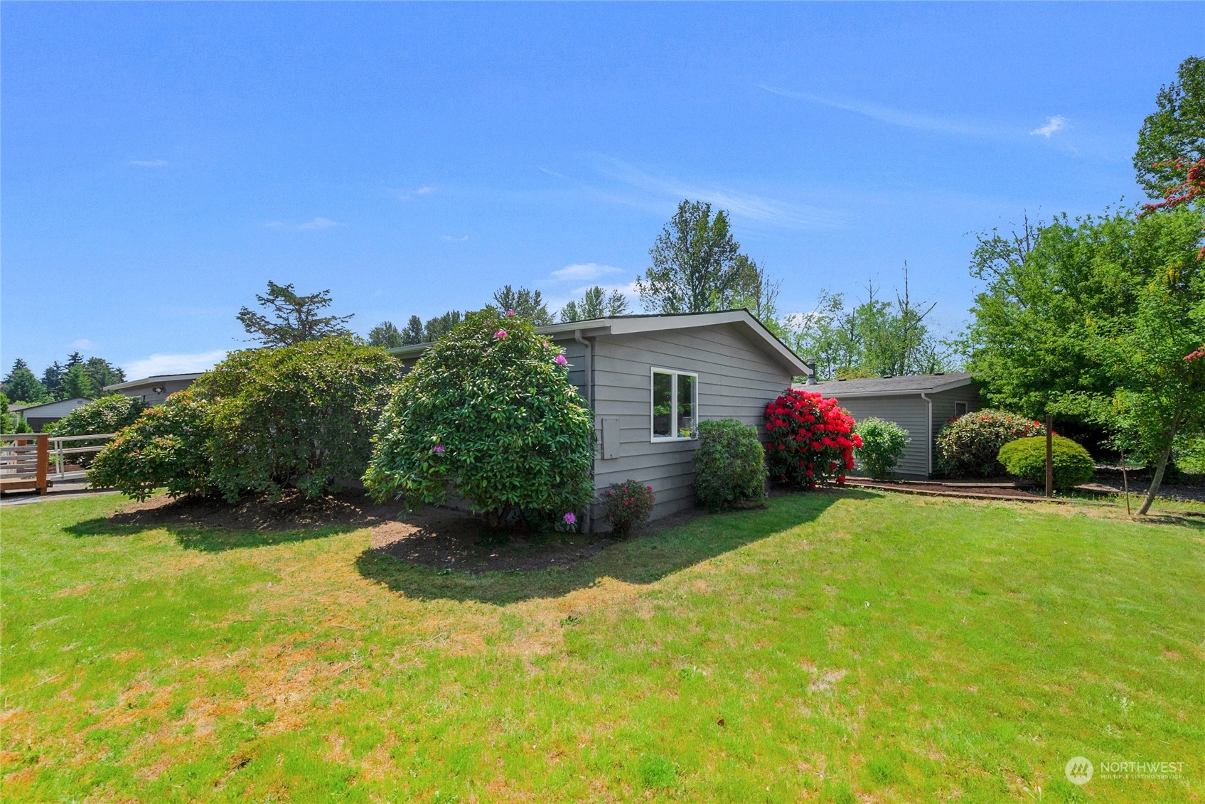 23714 Vista View Avenue Bothell, WA 98021 - Photo 5 of 6 a view of a house with backyard and garden