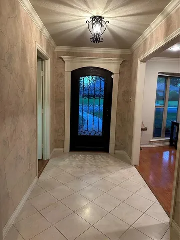 wooden floor in an empty room with a fireplace