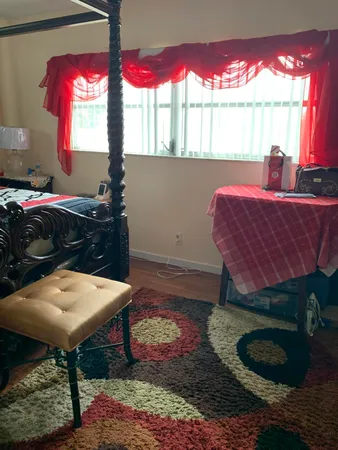 a room with furniture and a window