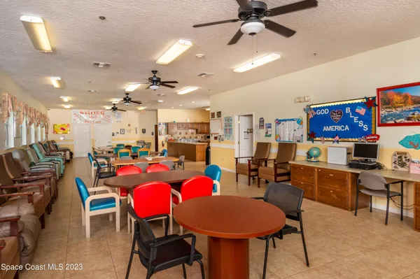 a group of people sitting at tables in a room