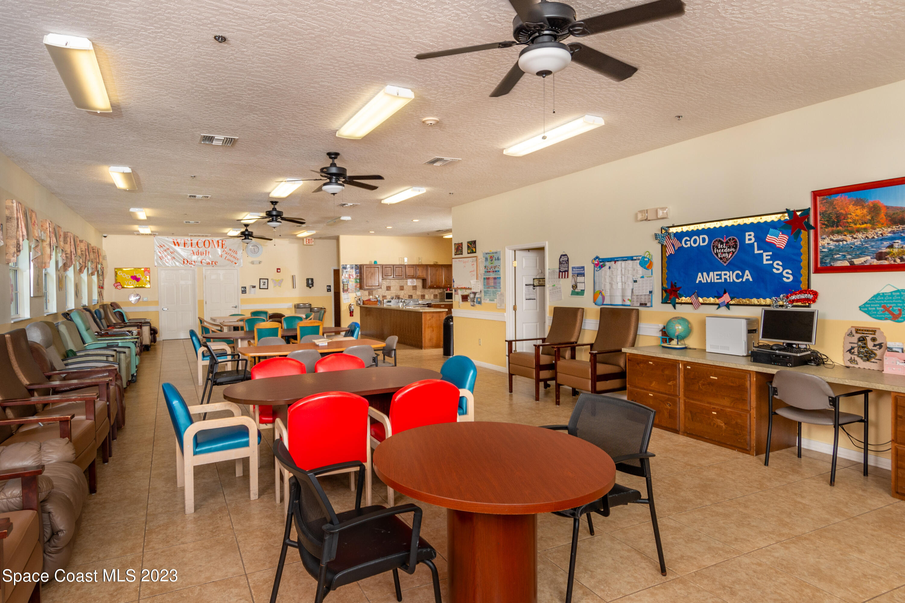 422 Martin Road Palm Bay, FL 32909 - Photo 14 of 37 a living room with lots of furniture and kitchen view
