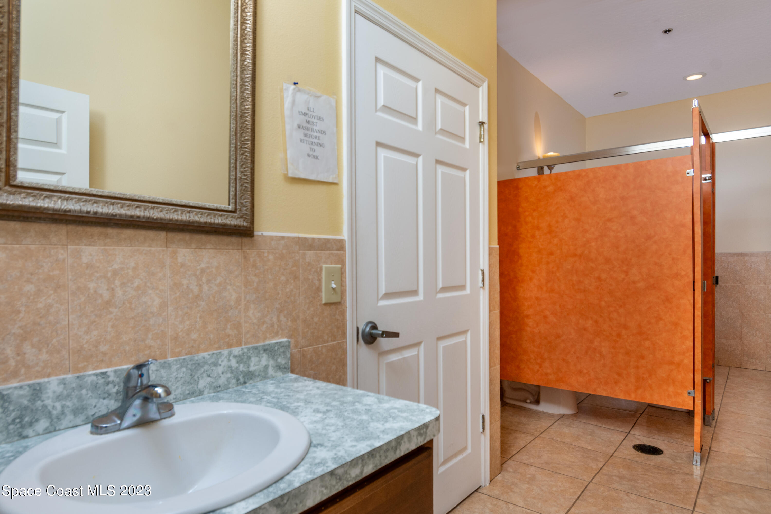 422 Martin Road Palm Bay, FL 32909 - Photo 24 of 37 a bathroom with a granite countertop sink and a mirror