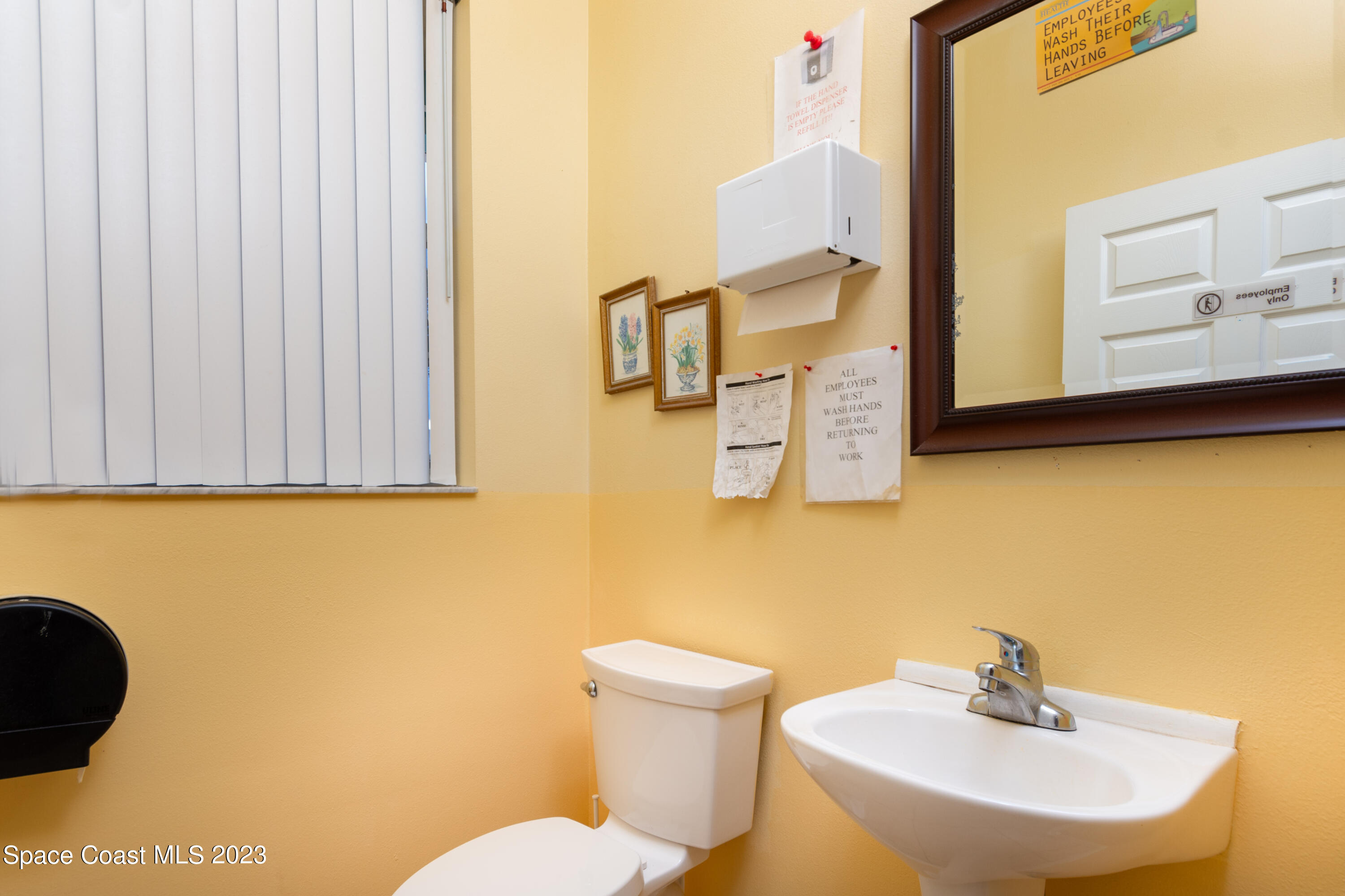 422 Martin Road Palm Bay, FL 32909 - Photo 25 of 37 a bathroom with a sink and a mirror