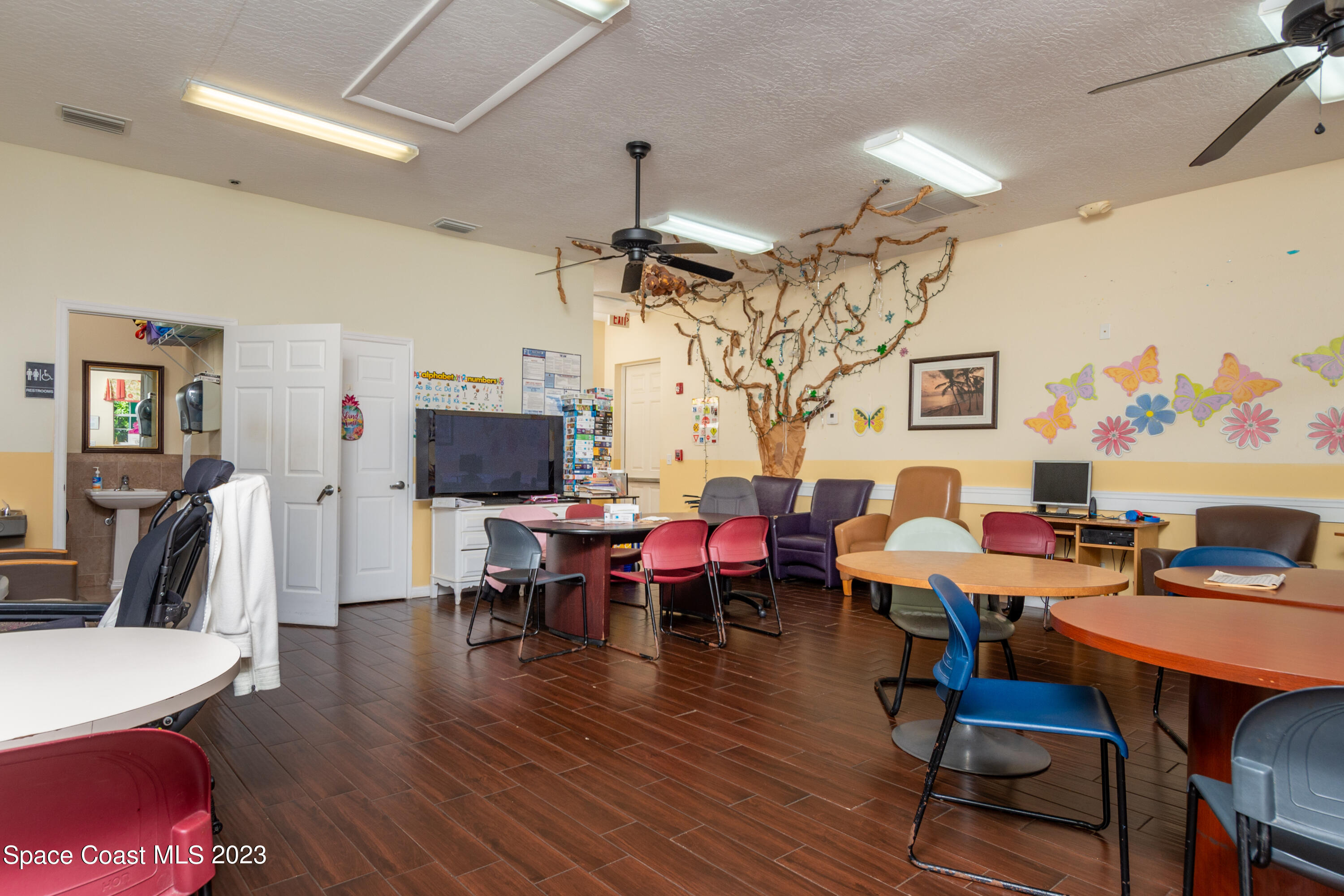 422 Martin Road Palm Bay, FL 32909 - Photo 30 of 37 a living room with lots of furniture and wooden floor