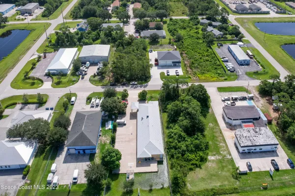 an aerial view of residential houses with outdoor space