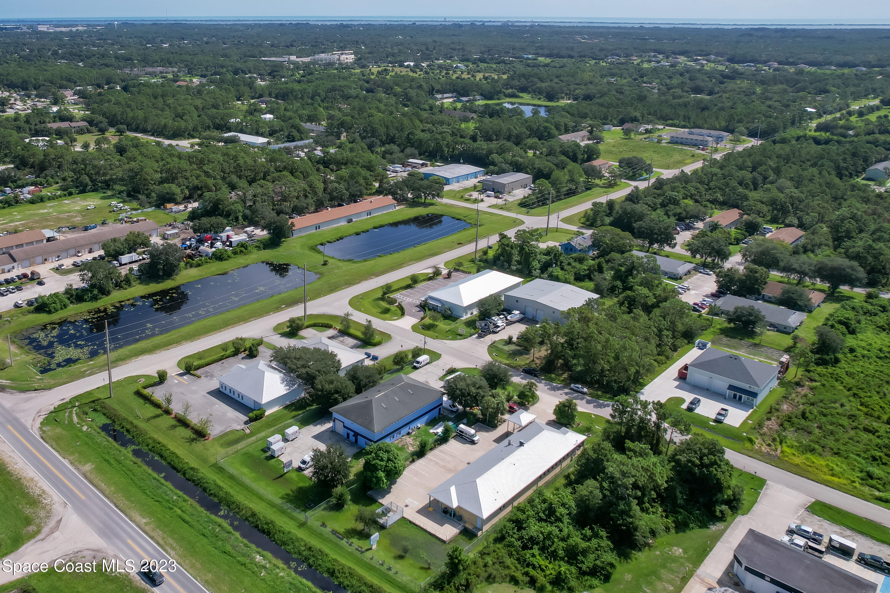 422 Martin Road Palm Bay, FL 32909 - Photo 8 of 37 an aerial view of residential houses with outdoor space