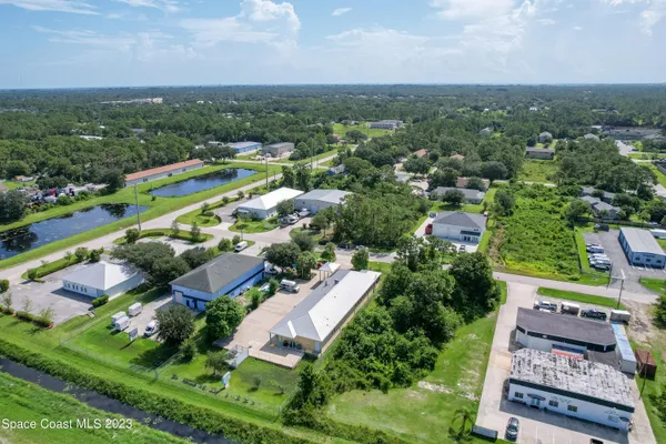 an aerial view of a house with a garden