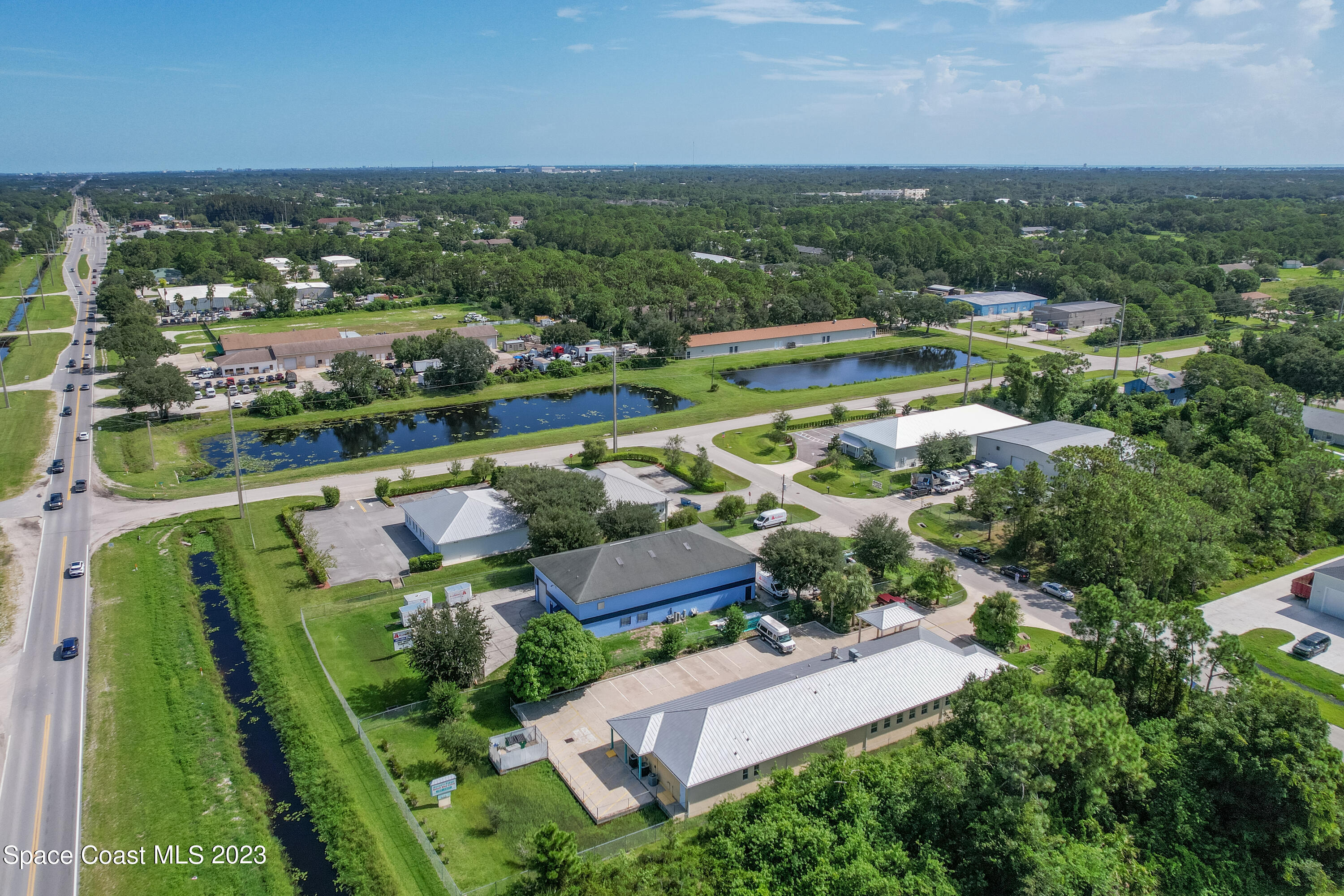 422 Martin Road Palm Bay, FL 32909 - Photo 10 of 37 an aerial view of a house with a garden