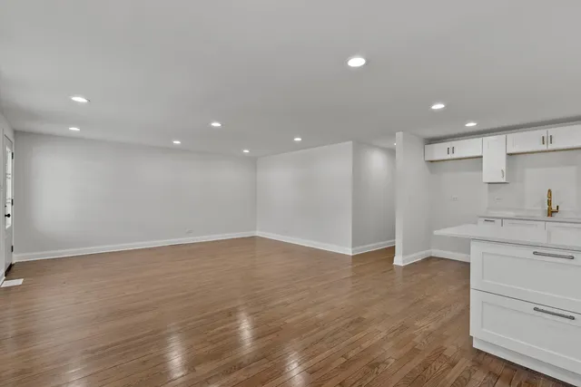 a view of a kitchen with a sink and dishwasher refrigerator stove