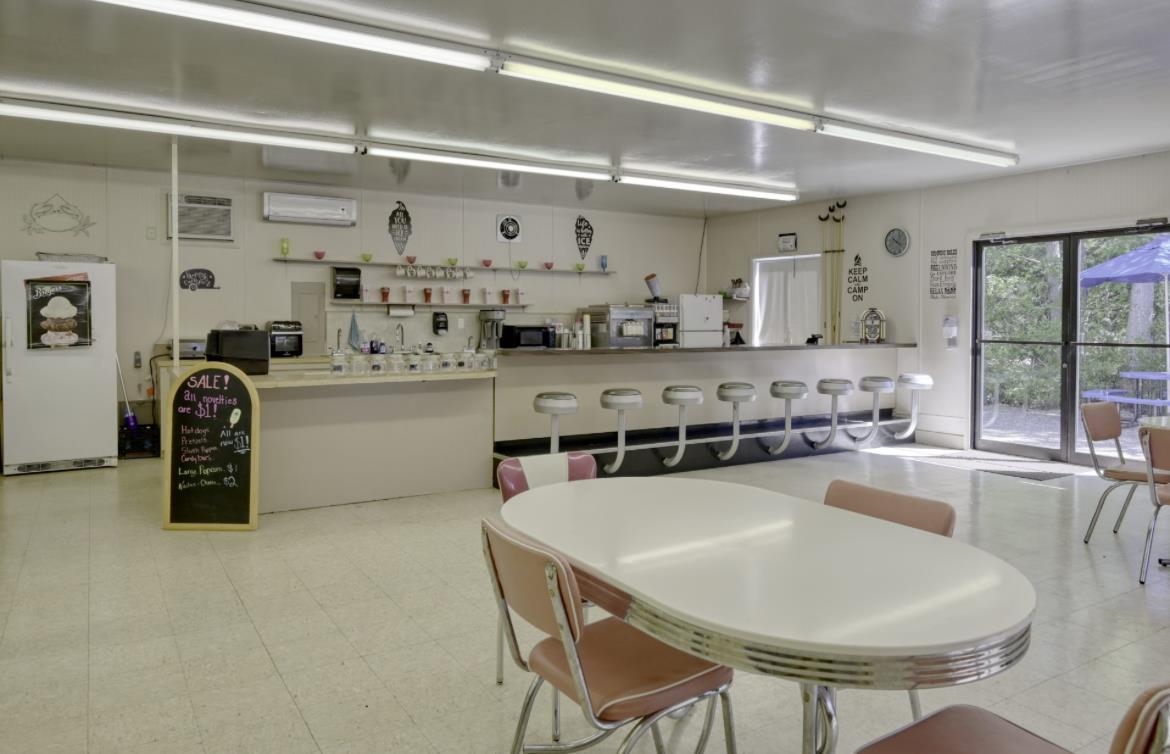 709 Highway 9 Cape May, NJ 08204 - Photo 13 of 16 a kitchen with stainless steel appliances granite countertop a sink and cabinets