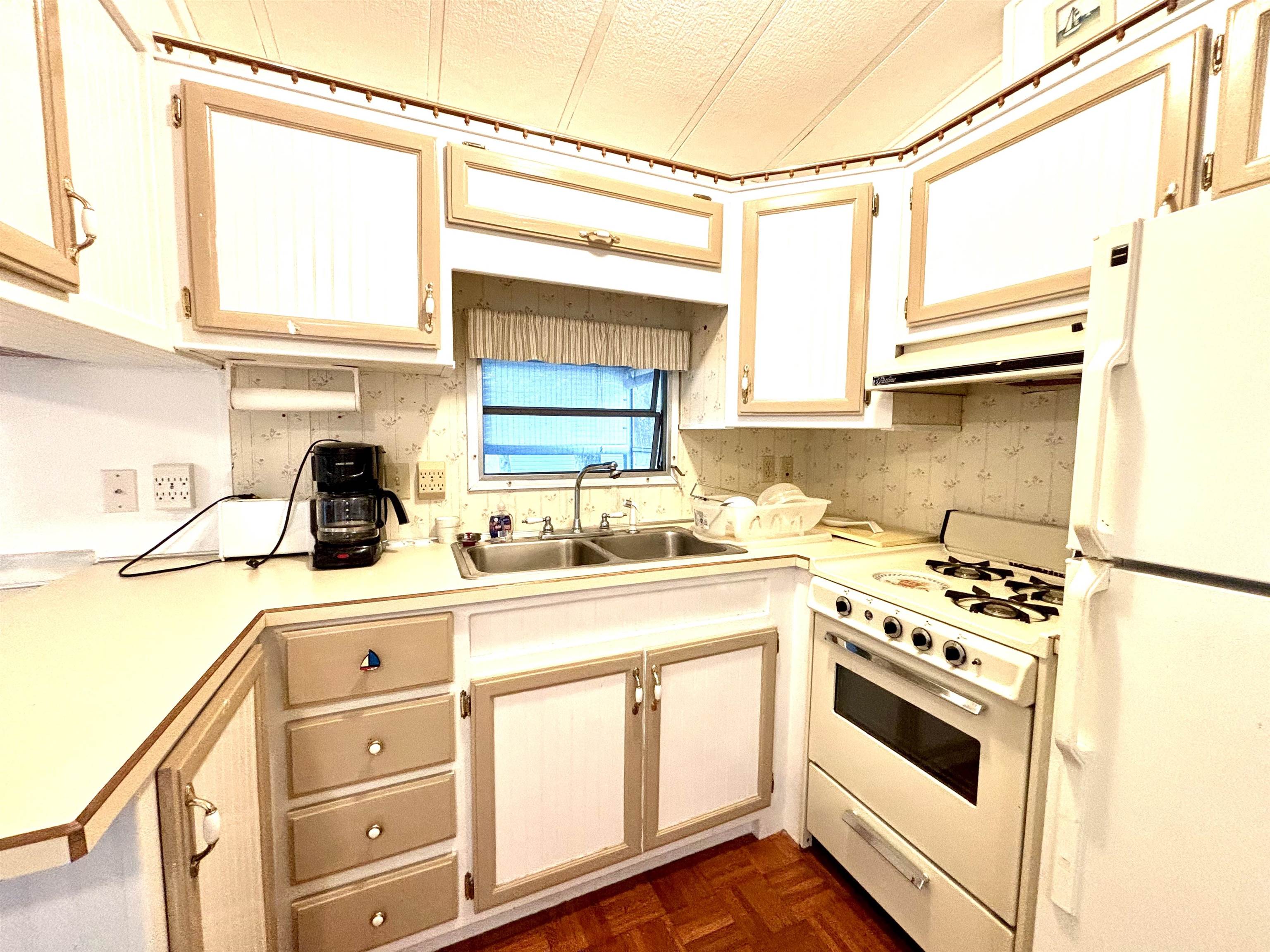 709 Highway 9 Cape May, NJ 08204 - Photo 4 of 16 a kitchen with white cabinets and white appliances