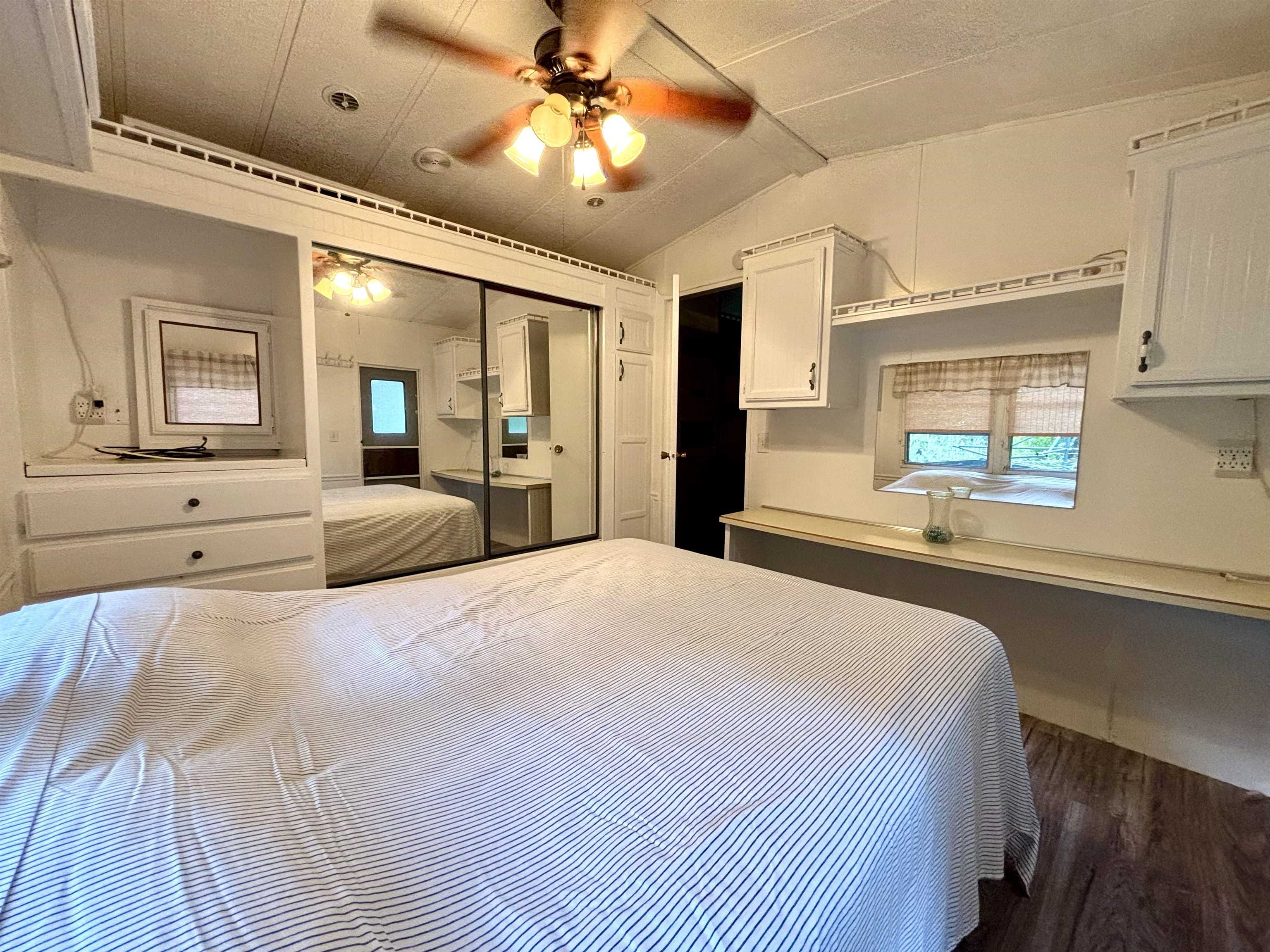 709 Highway 9 Cape May, NJ 08204 - Photo 6 of 16 a bedroom with a large bed and a large window
