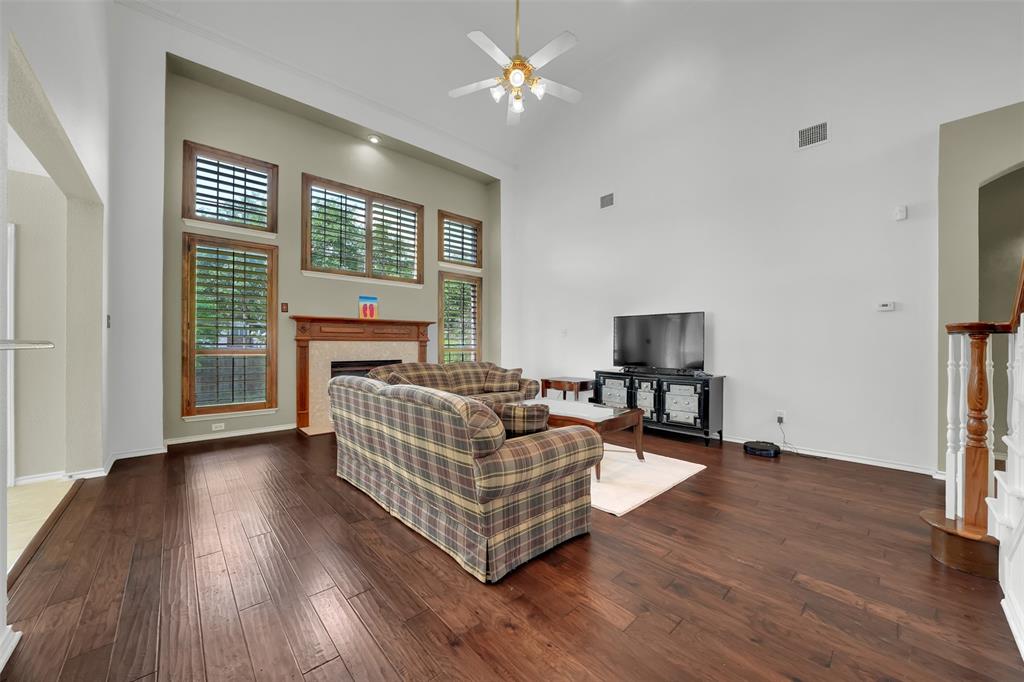 1333 Lighthouse Lane Allen, TX 75013 - Photo 13 of 40 a living room with furniture and a flat screen tv