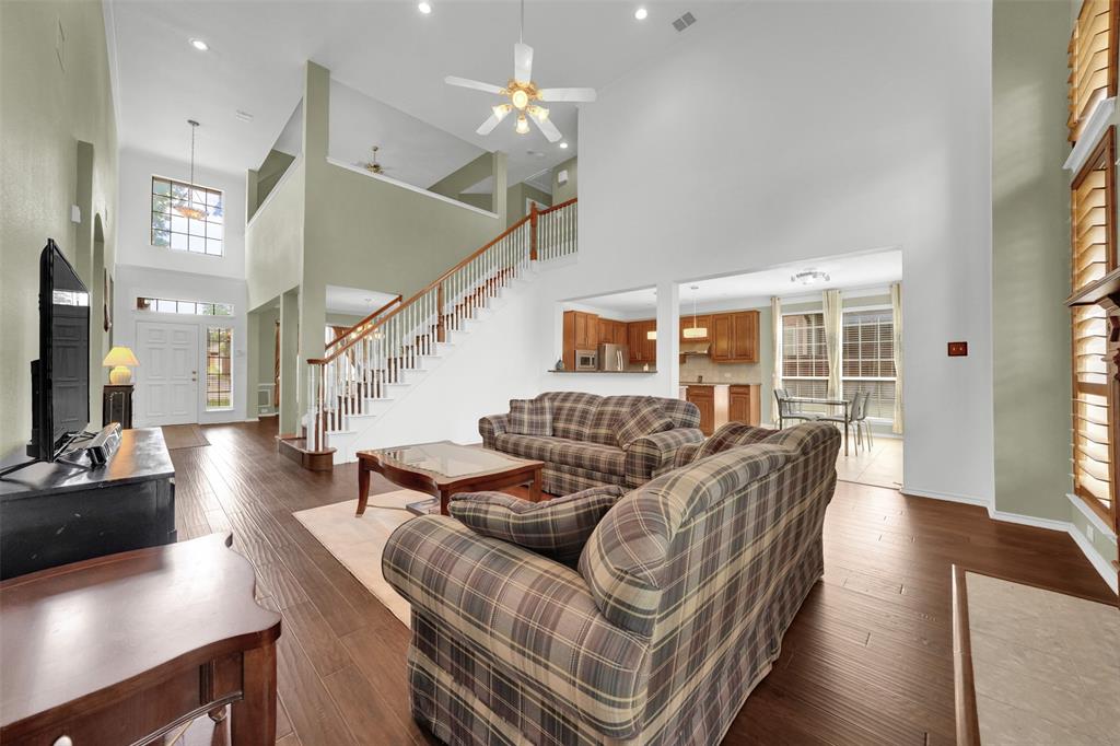 1333 Lighthouse Lane Allen, TX 75013 - Photo 15 of 40 a living room with furniture and wooden floor