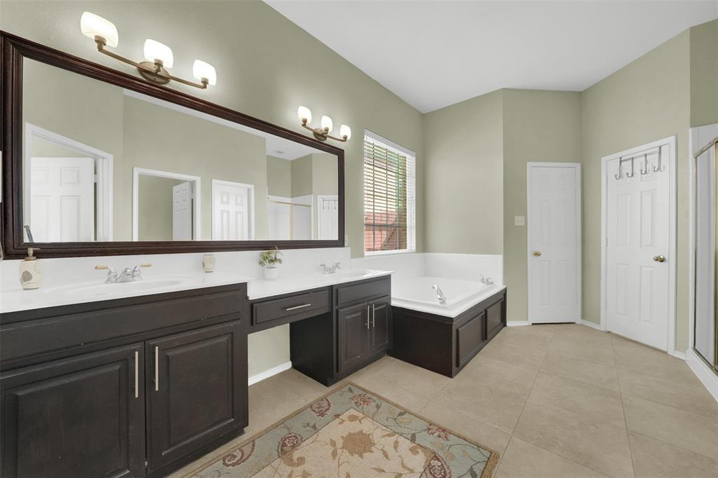 1333 Lighthouse Lane Allen, TX 75013 - Photo 20 of 40 a bathroom with a sink double vanity granite tub and a mirror