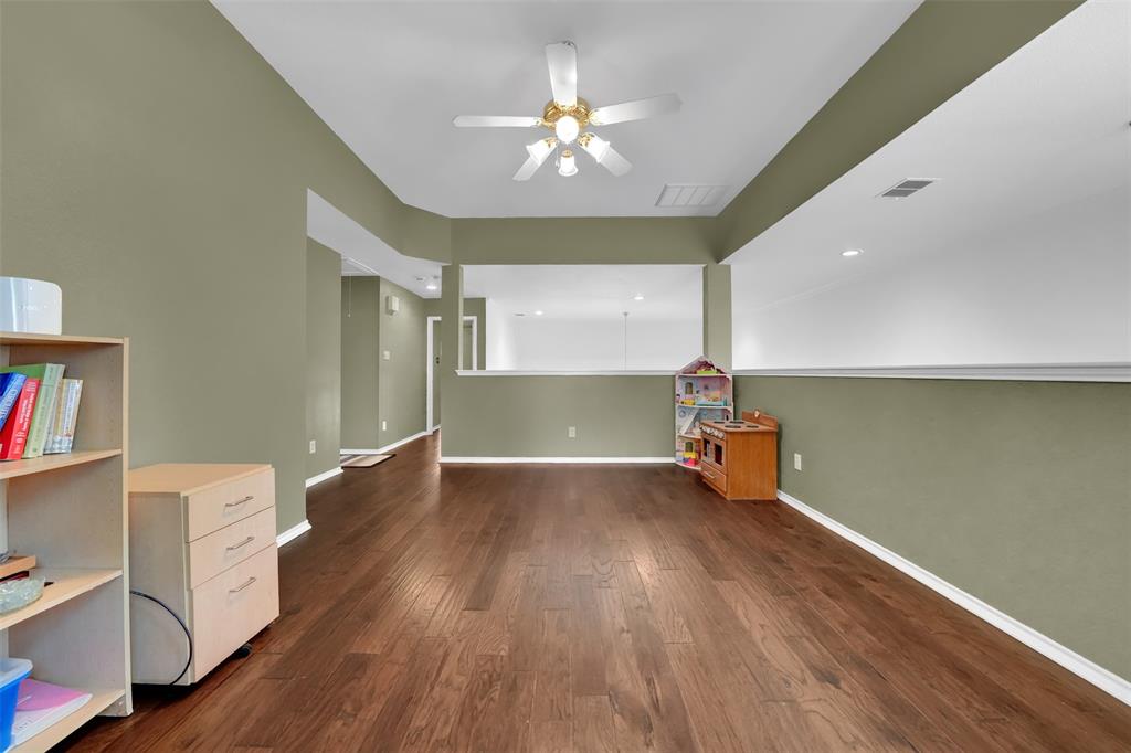 1333 Lighthouse Lane Allen, TX 75013 - Photo 29 of 40 a view of an empty room with a window and wooden floor