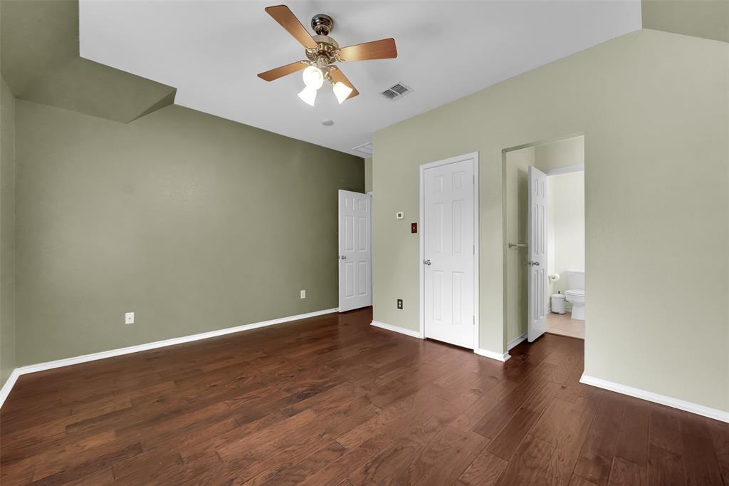1333 Lighthouse Lane Allen, TX 75013 - Photo 34 of 40 an empty room with wooden floor and ceiling fan