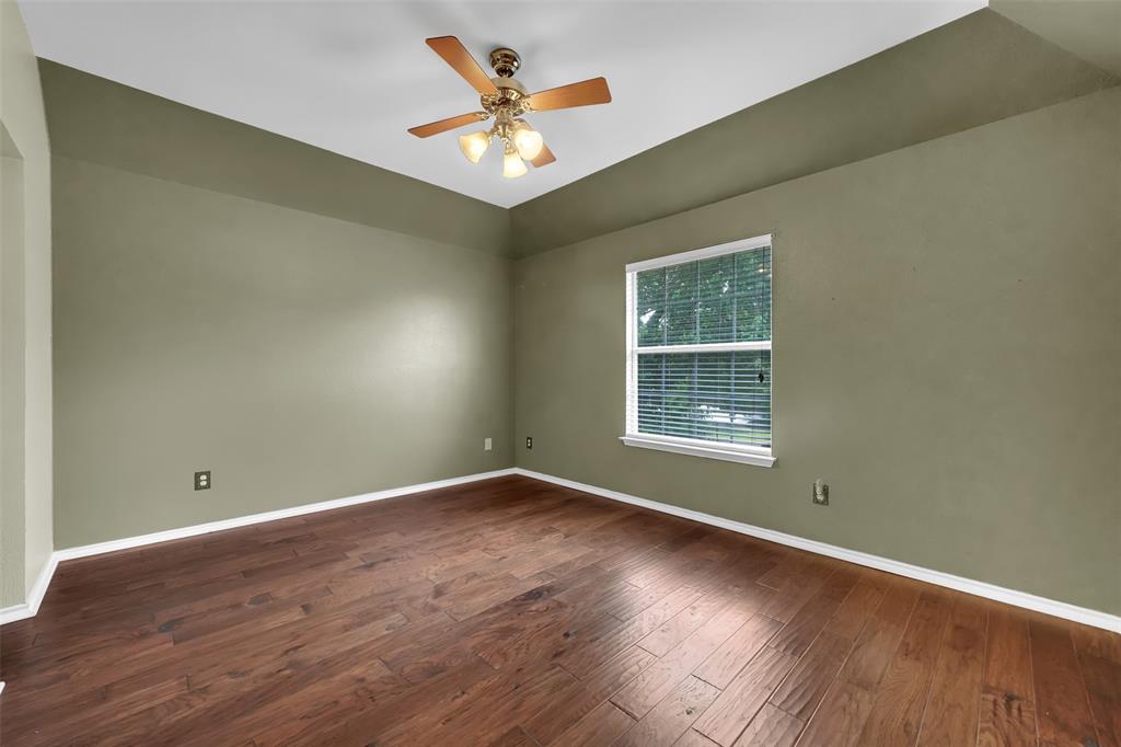1333 Lighthouse Lane Allen, TX 75013 - Photo 35 of 40 an empty room with wooden floor and windows