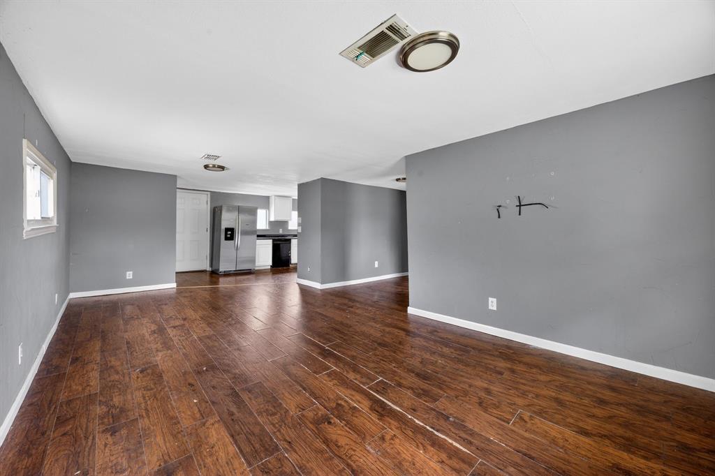 130 Center Street Nevada, TX 75173 - Photo 12 of 32 a view of empty room with wooden floor