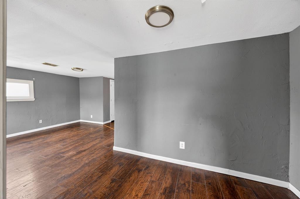 130 Center Street Nevada, TX 75173 - Photo 14 of 32 a view of an empty room with a window