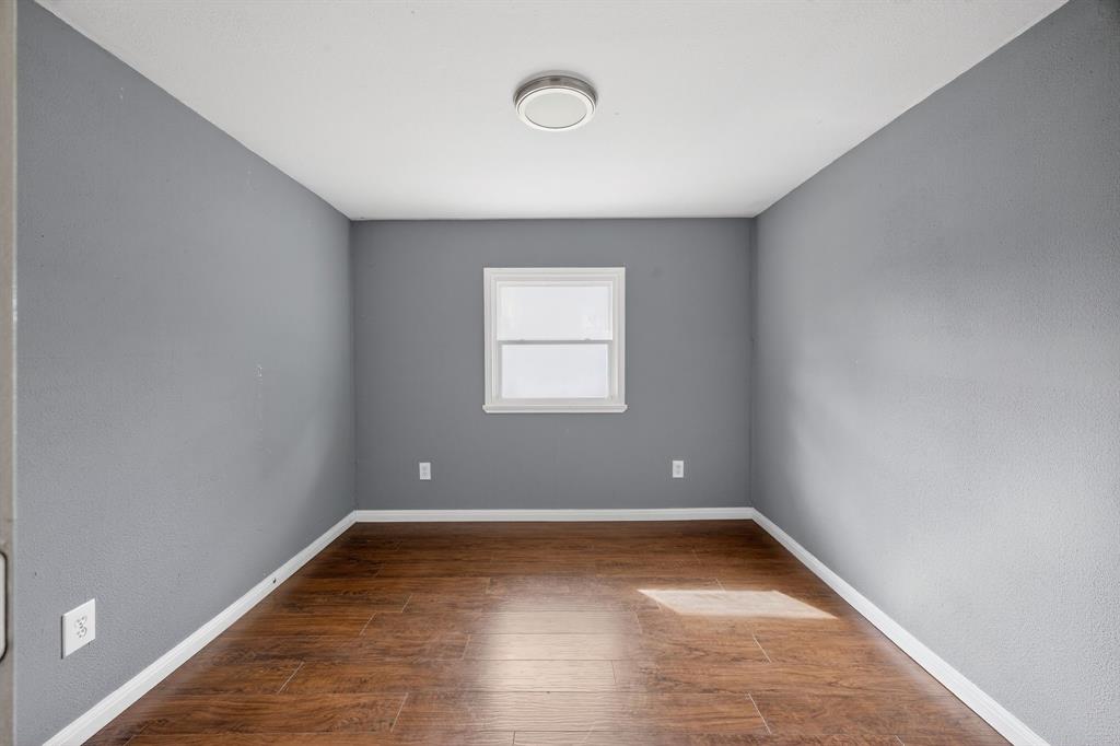130 Center Street Nevada, TX 75173 - Photo 15 of 32 a view of a room with wooden floor and window
