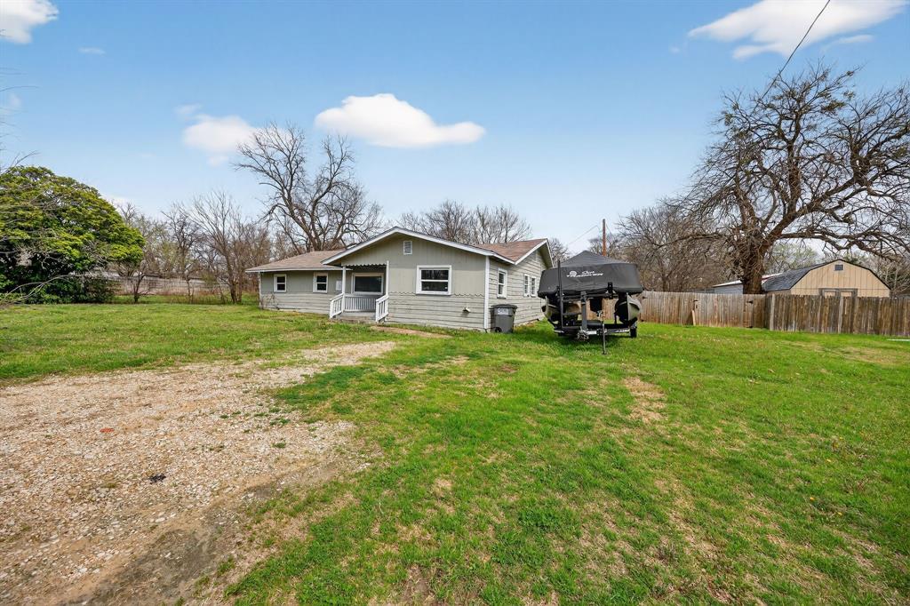 130 Center Street Nevada, TX 75173 - Photo 2 of 32 a front view of a house with garden
