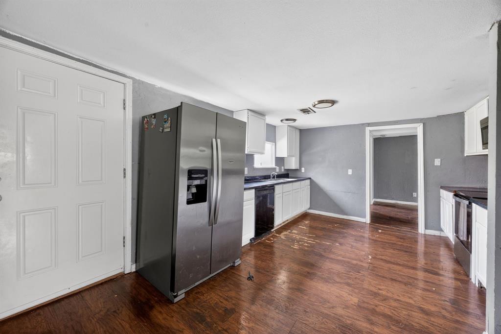 130 Center Street Nevada, TX 75173 - Photo 25 of 32 a kitchen with a refrigerator and a sink