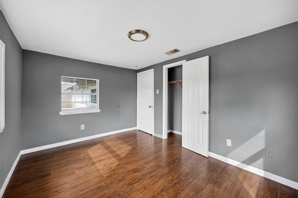 130 Center Street Nevada, TX 75173 - Photo 27 of 32 a view of an empty room with wooden floor and a window