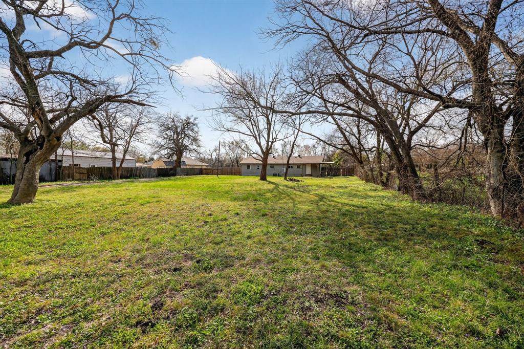 130 Center Street Nevada, TX 75173 - Photo 5 of 32 a view of a trees with a yard