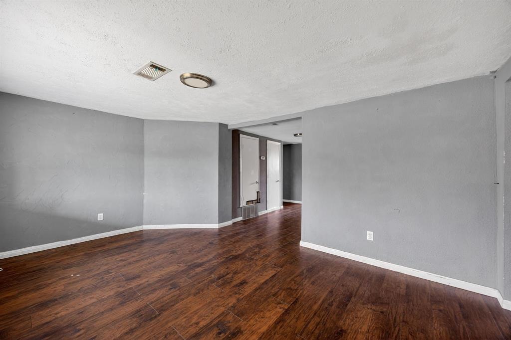 130 Center Street Nevada, TX 75173 - Photo 9 of 32 a view of an empty room with wooden floor