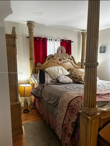 a kitchen with stainless steel appliances a sink a stove a refrigerator a sink a counter space and cabinets