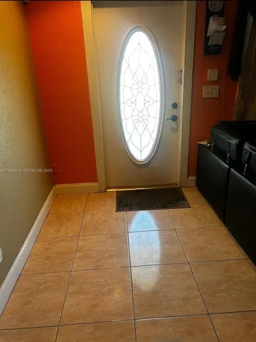 a kitchen with stainless steel appliances granite countertop a refrigerator a stove and a sink