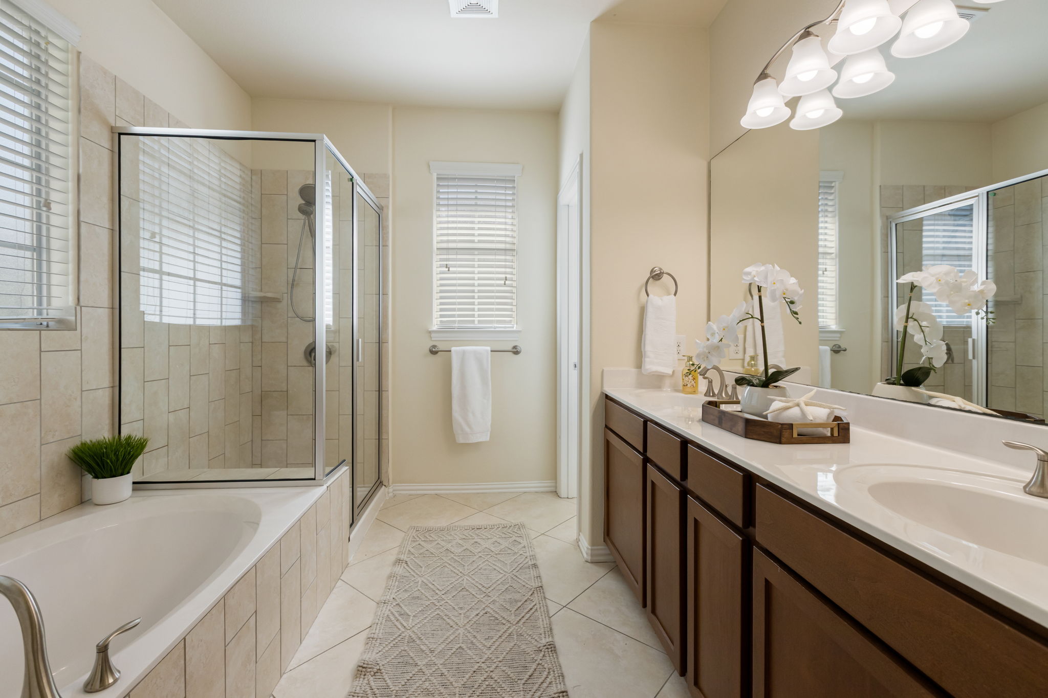 6715 Windrift Way, Unit 20 Austin, TX 78745 - Photo 27 of 38 Primary Bath - double vanity, soaking tub, walk-in shower and wonderful natural light