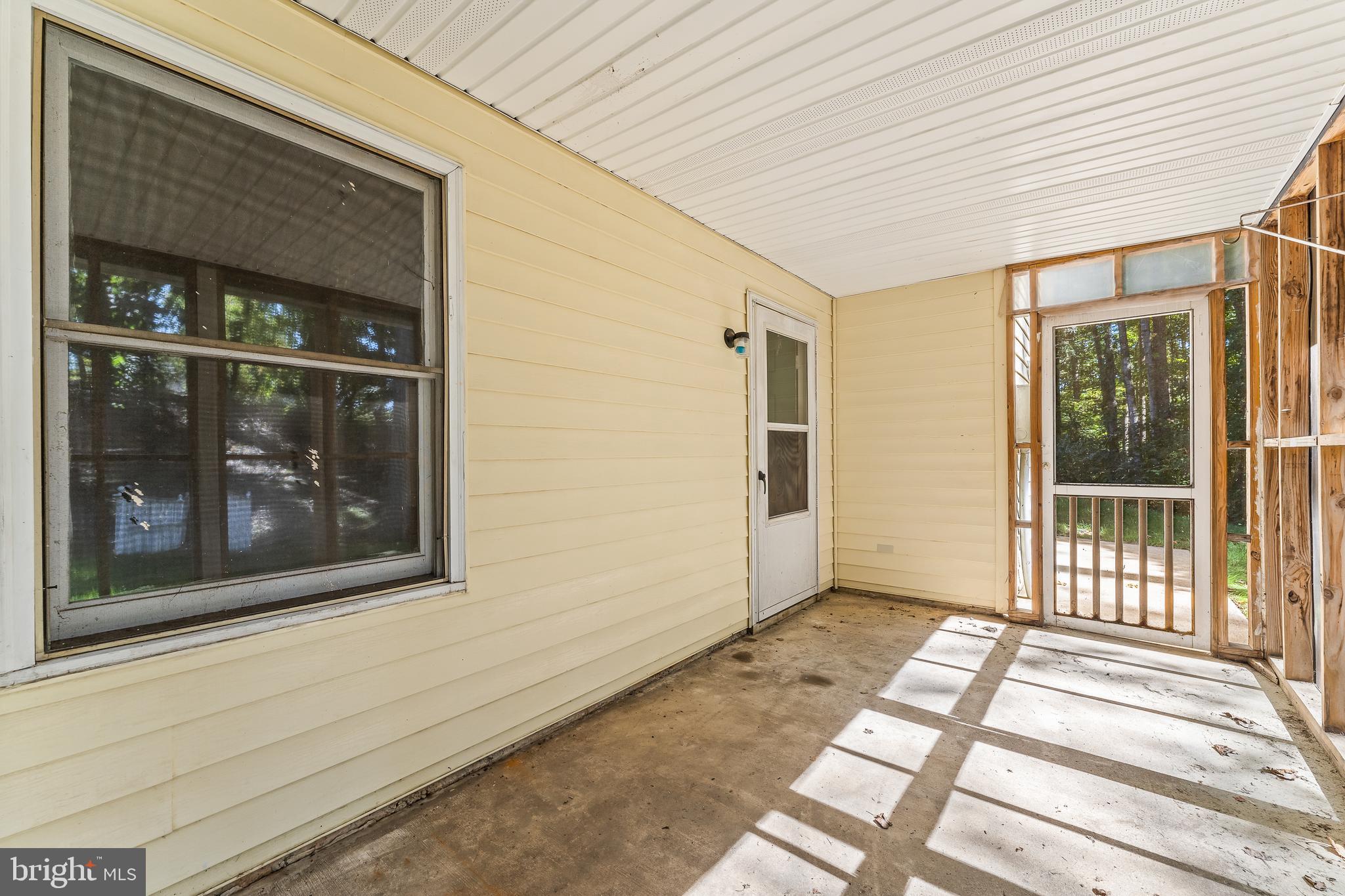 4924 Harrison Road Fredericksburg, VA 22408 - Photo 51 of 62 Screened in patio outside of basement entrance