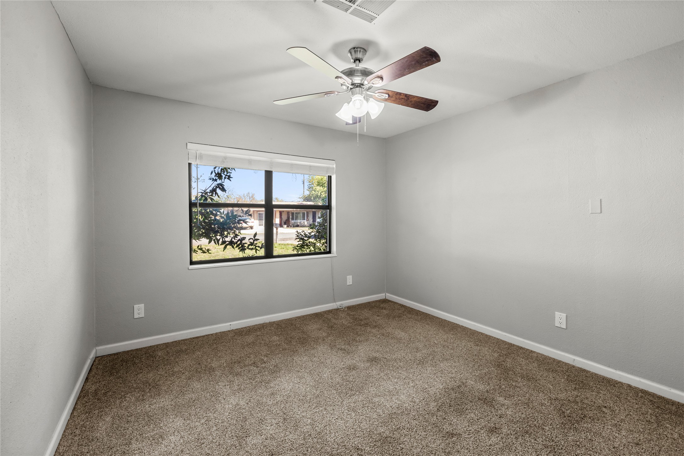 1401 Brazos Street Marble Falls, TX 78654 - Photo 12 of 23 Unfurnished room with carpet and a ceiling fan